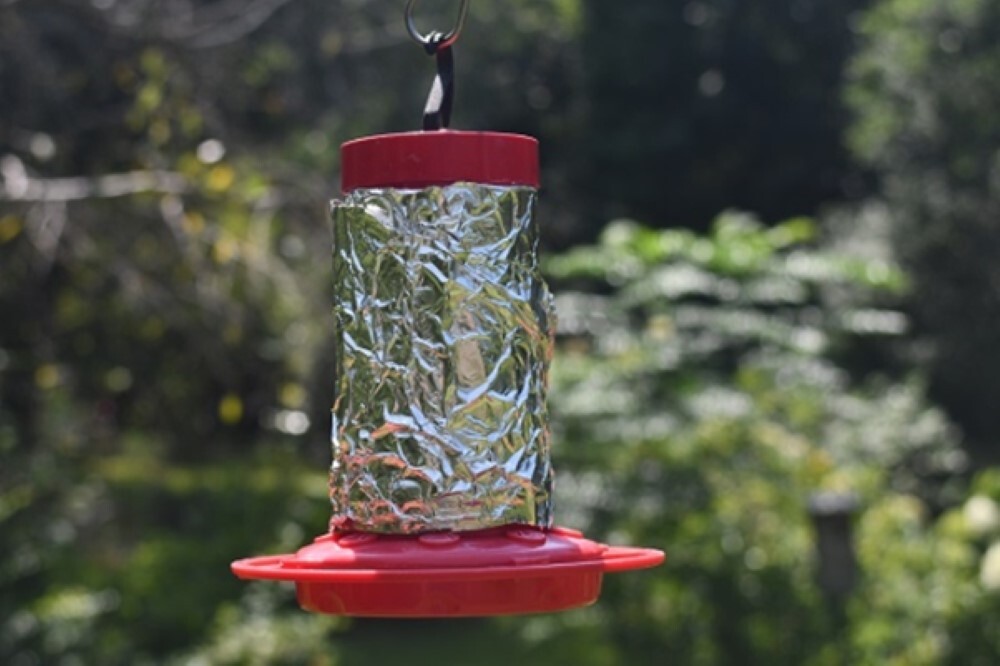 Aluminium foil hack keeps hummingbird feeders cool & nectar safe this summer